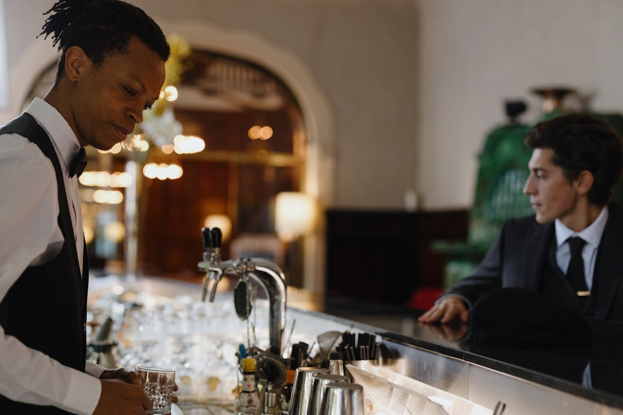 Hotel bar team during service supported by hotel IT systems